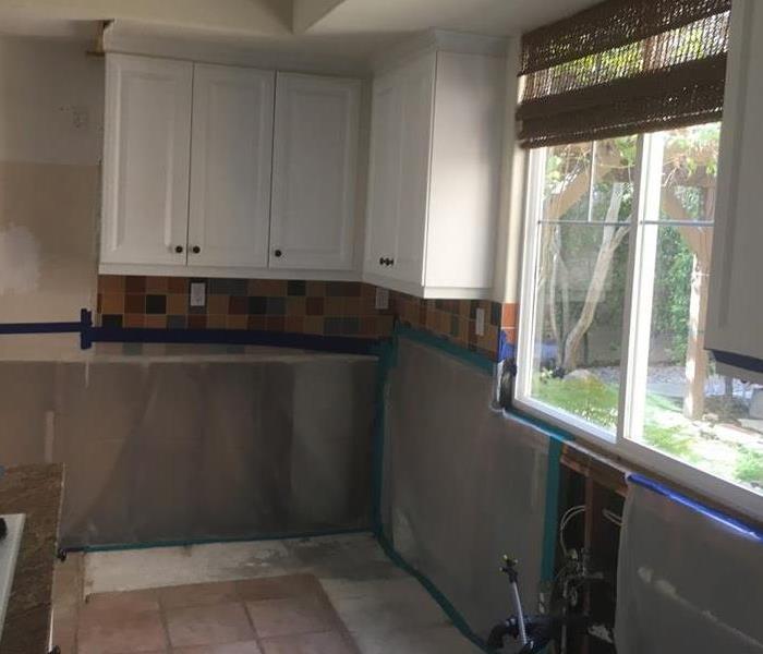 kitchen with mold remediated and covered with containment material